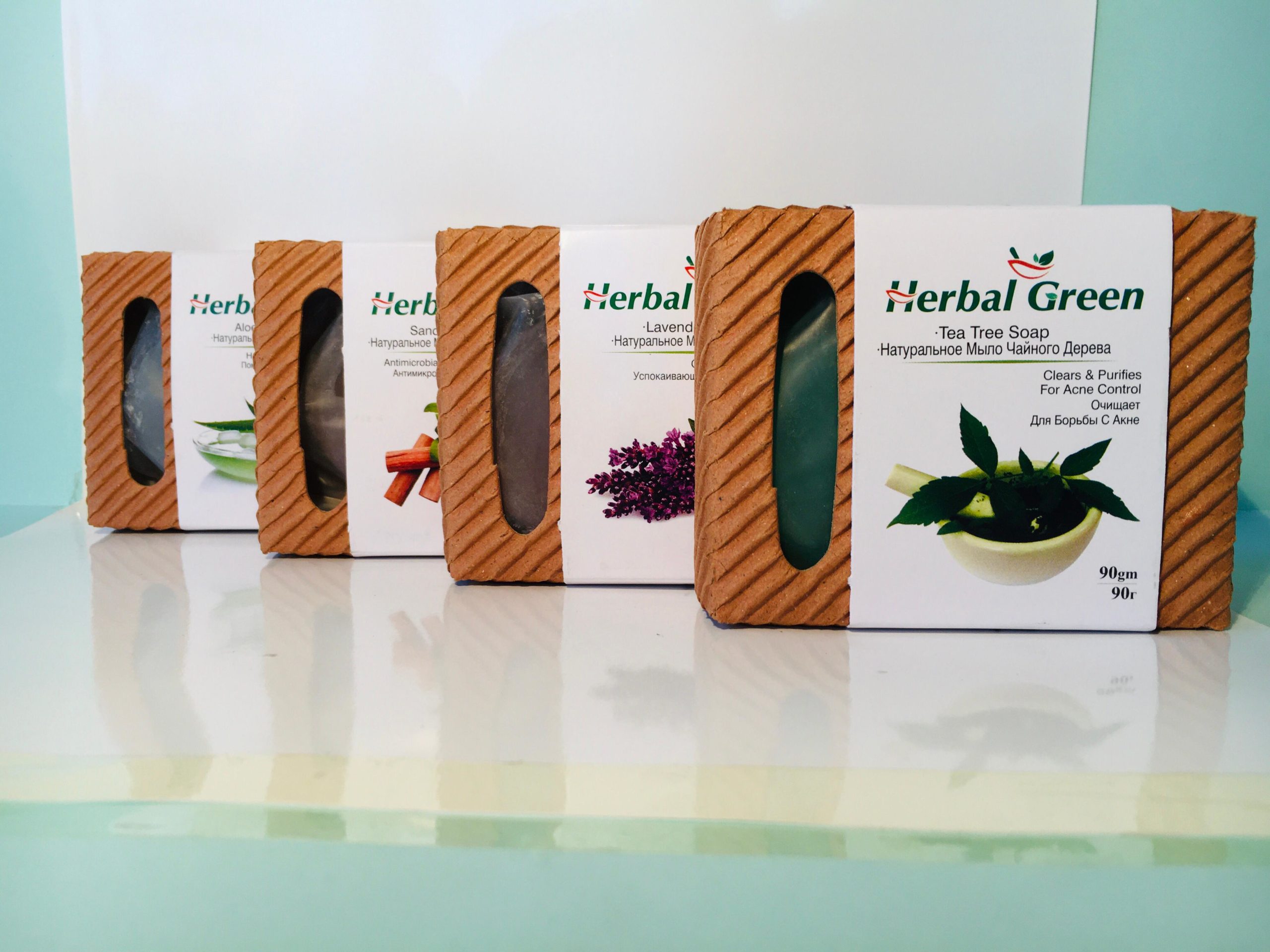 Herbal Green Aloe Vera Soap bar, shown with fresh aloe leaves and gel